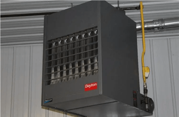 Dayton gas furnace is hang on the ceiling near a wall